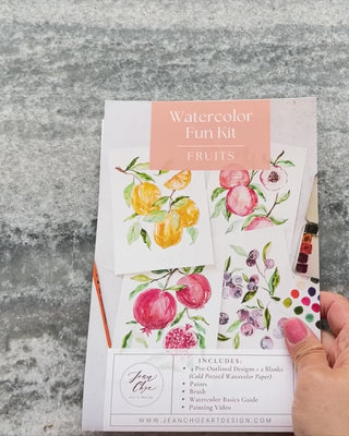 Video showing Jean Choe's watercolor fun kit for Fruits of lemons, peaches, pomegranates and blueberries with pre-outlined pages, a paint dot card and a brush.