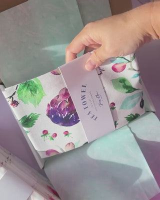 Video showing Jean Choe's cotton canvas tea towel with vibrant watercolor florals
