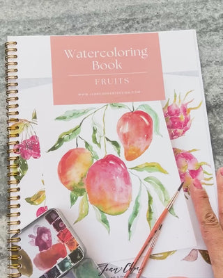Video showing Jean Choe's watercolor workbook for Fruits, with pre-outlined pages, and step by step instructions.