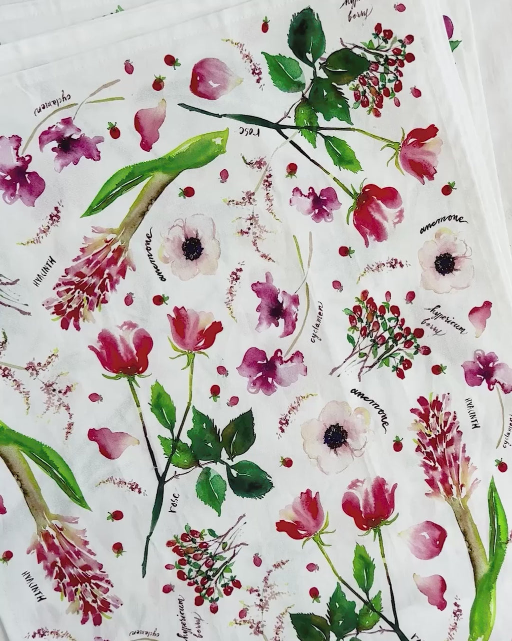 Video showing Jean Choe's cotton canvas tea towel with vibrant watercolor floral